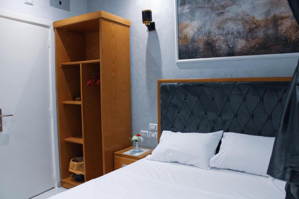 Postel nebo postele na pokoji v ubytování Olivia Hotel