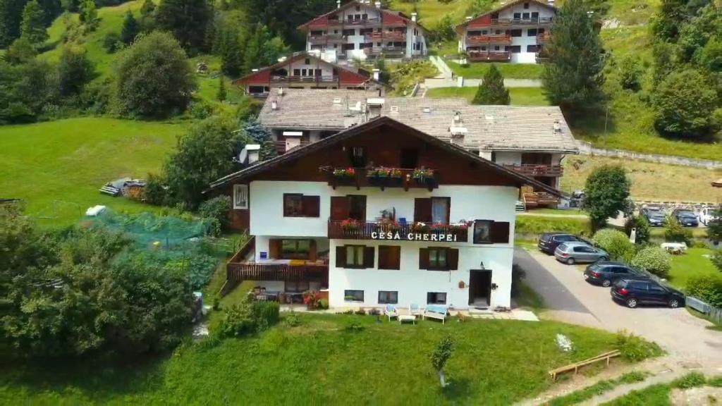 an aerial view of a building with a parking lot at Cèsa Cherpei - Dog Friendly in Campitello di Fassa