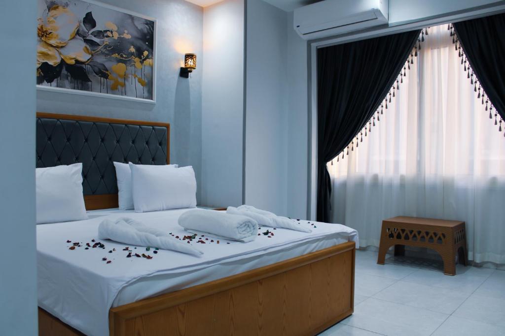 Postel nebo postele na pokoji v ubytování Olivia Hotel