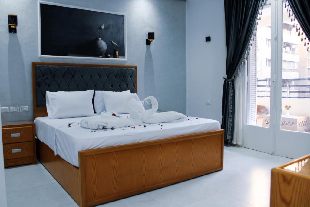 Postel nebo postele na pokoji v ubytování Olivia Hotel
