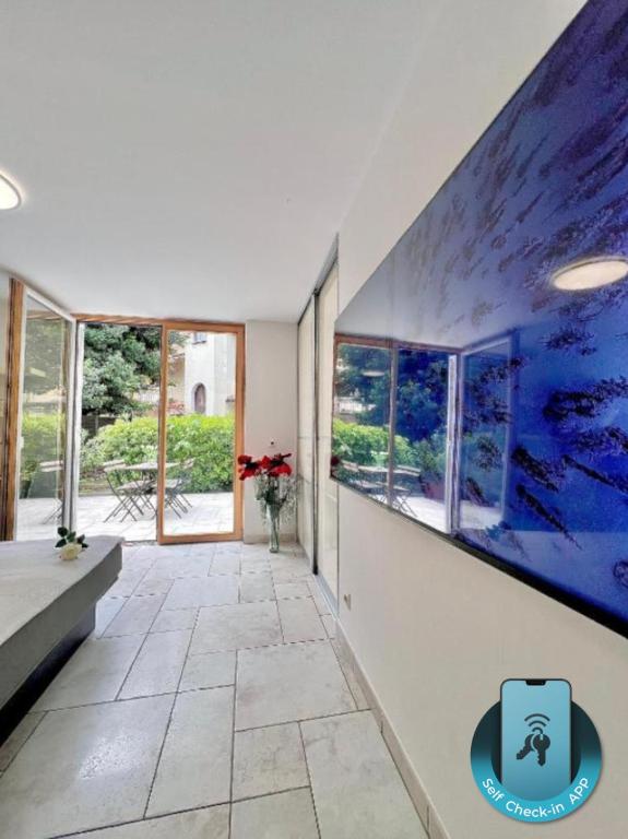 a hallway with a large painting on the wall at Anabella Apartment in Izola