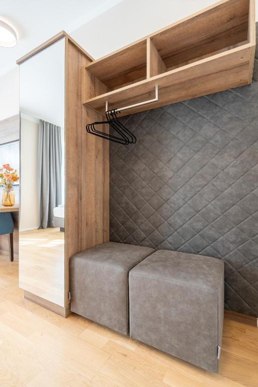 Postel nebo postele na pokoji v ubytování Das Jedermann Boutiquehotel mit Stadtgarten