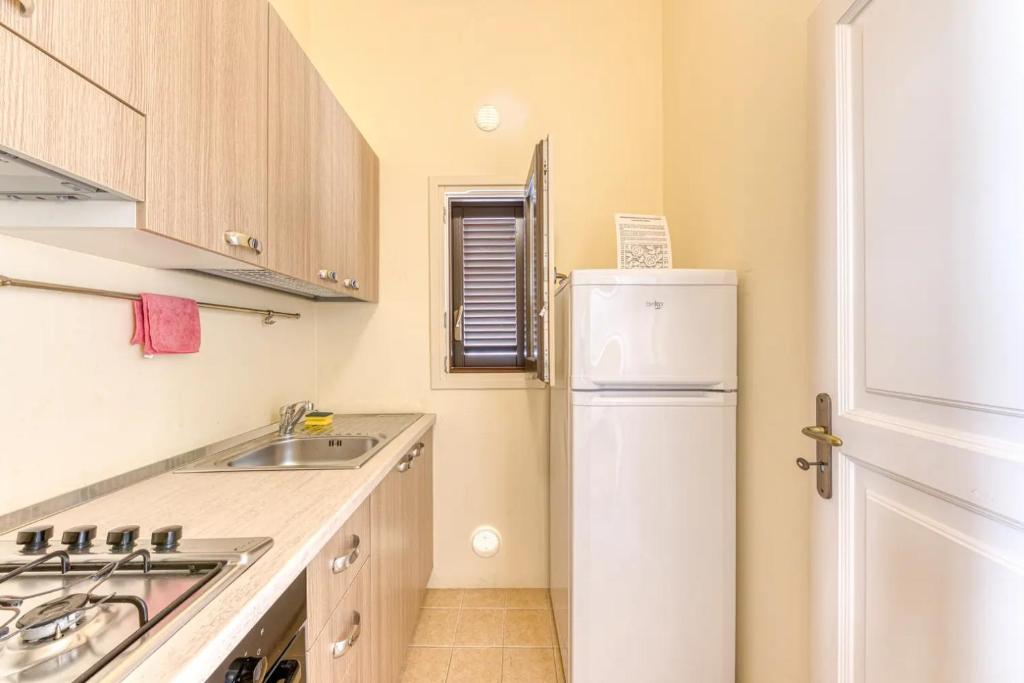 A kitchen or kitchenette at La Corte dei Mille