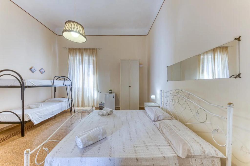 A bed or beds in a room at La Corte dei Mille