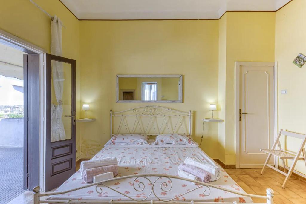 A bed or beds in a room at La Corte dei Mille