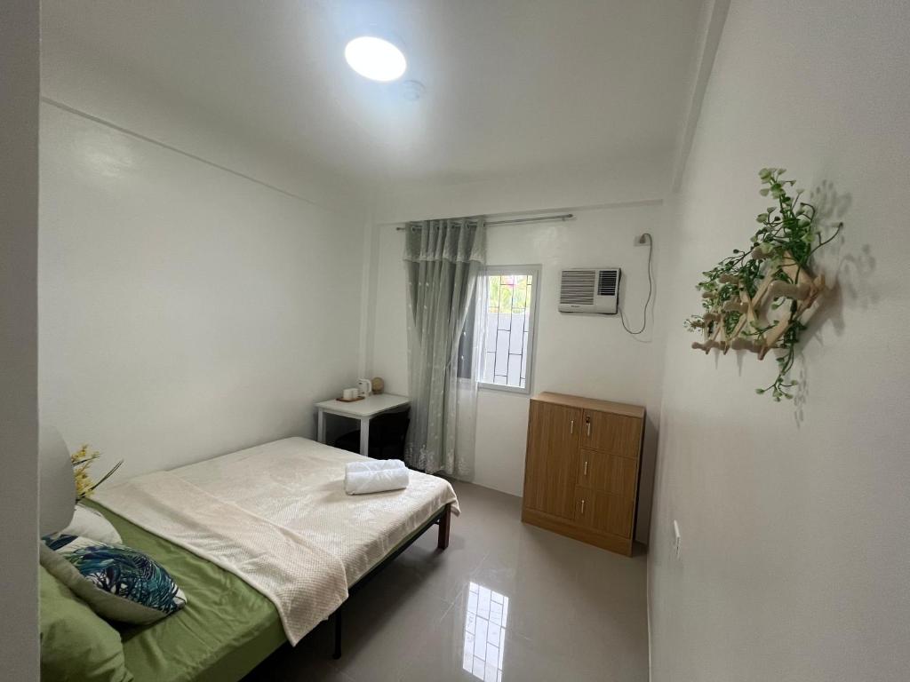 Postel nebo postele na pokoji v ubytování Ash Home