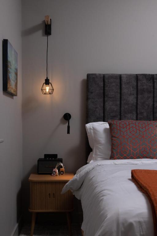 Postel nebo postele na pokoji v ubytování Montgomery House Apart-Hotel