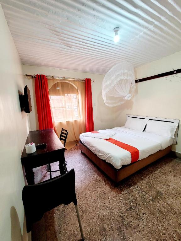 Postel nebo postele na pokoji v ubytování Nairobi City Space Hotel
