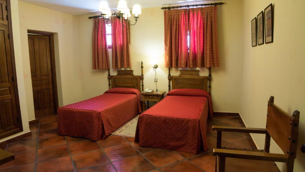 Postel nebo postele na pokoji v ubytování Hotel Las Cancelas