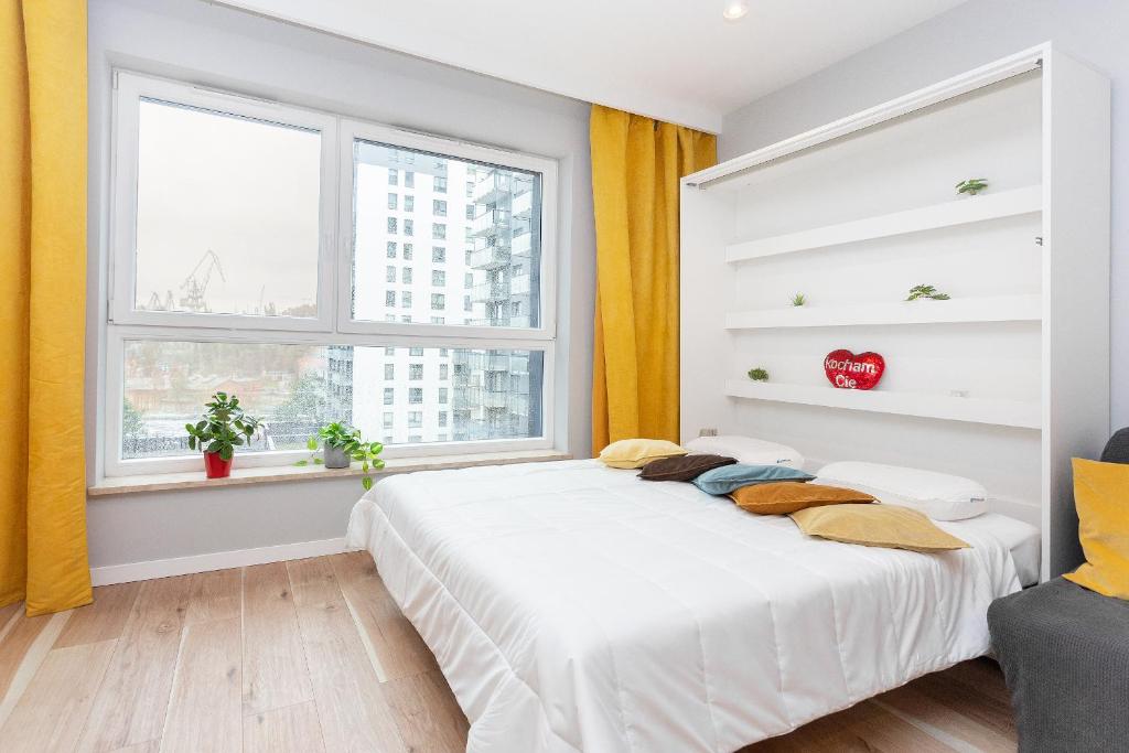 Postel nebo postele na pokoji v ubytování AVRA Residence III Stare Miasto