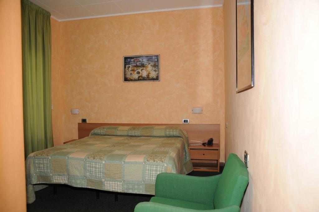 Postel nebo postele na pokoji v ubytování Hotel Valentini Inn