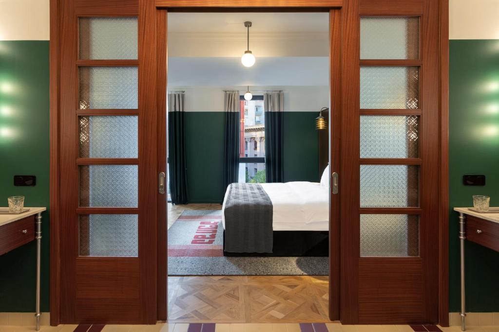 Postel nebo postele na pokoji v ubytování Hotel Afisha