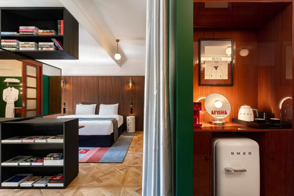 Postel nebo postele na pokoji v ubytování Hotel Afisha