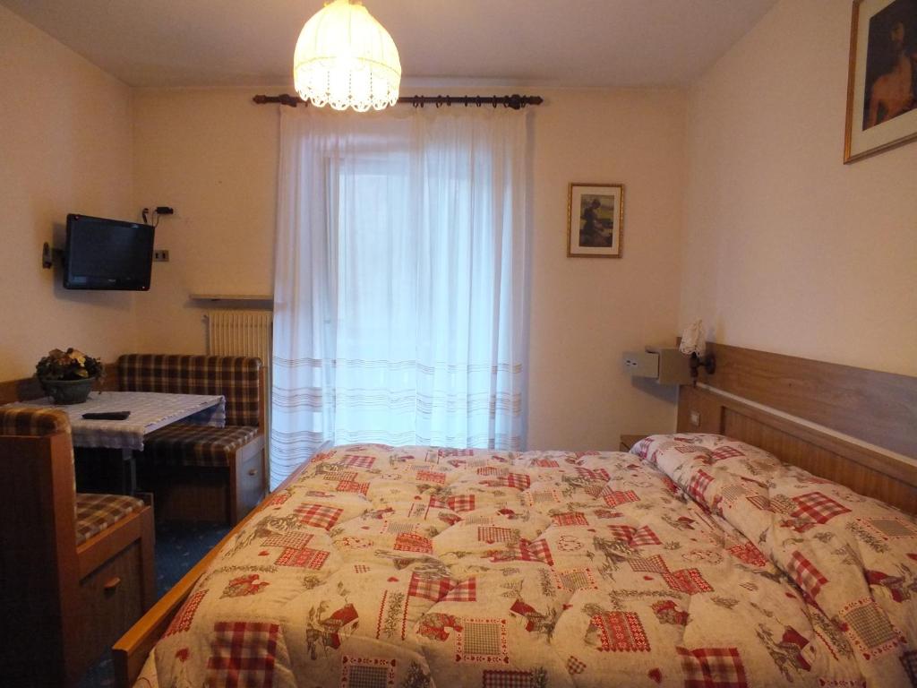 Postel nebo postele na pokoji v ubytování Garnì Defrancesco