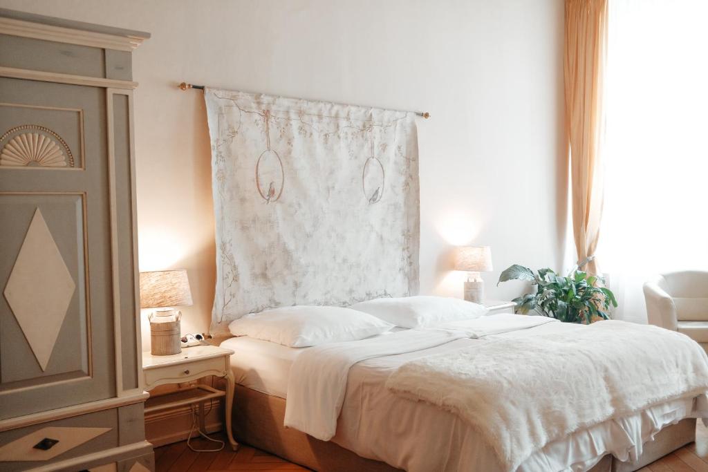 Postel nebo postele na pokoji v ubytování Hotel am Museum