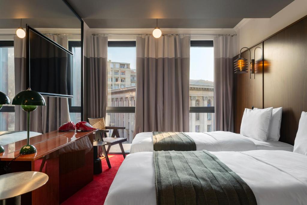 Postel nebo postele na pokoji v ubytování Hotel Afisha