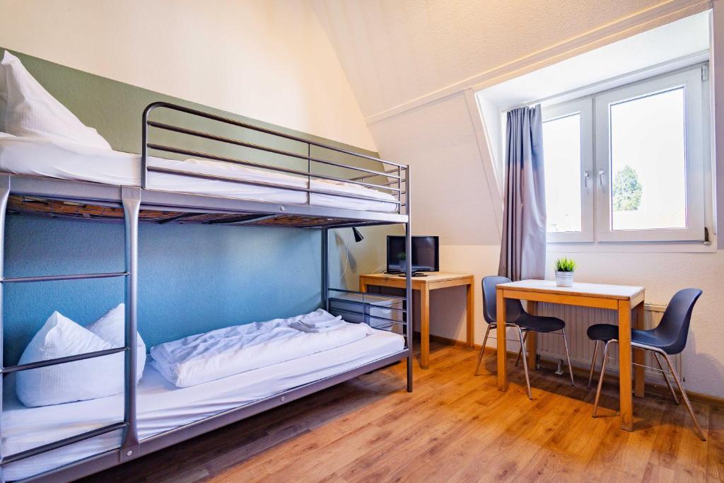 Postel nebo postele na pokoji v ubytování StayInn Hostel und Gästehaus