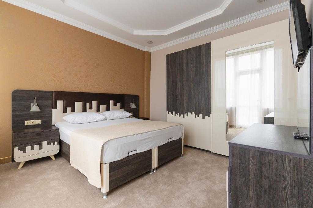 Postel nebo postele na pokoji v ubytování Grand Georgian Palace