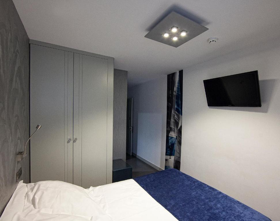 Posteľ alebo postele v izbe v ubytovaní Hostal Averroes