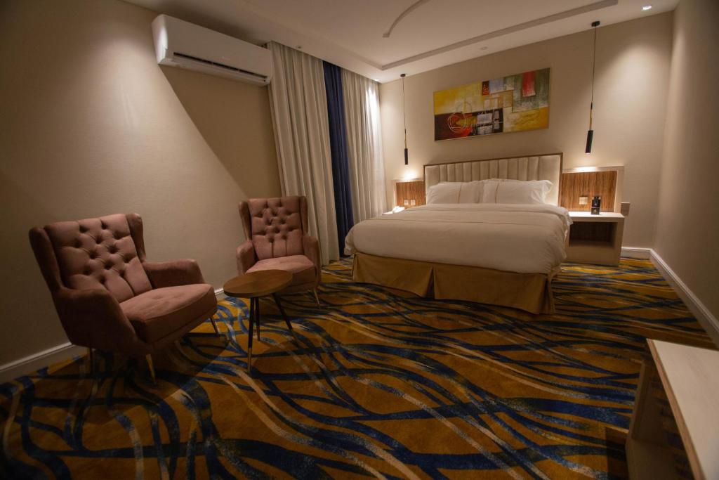 Postel nebo postele na pokoji v ubytování فندق قوبا السويس - Quba Swess Hotel Jazan