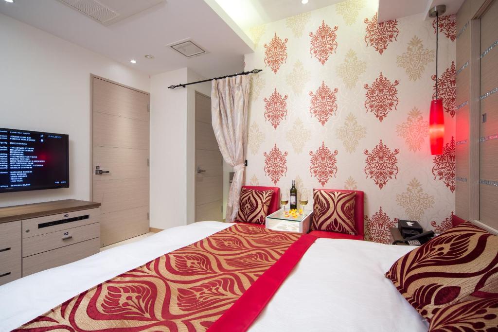 Postel nebo postele na pokoji v ubytování Hotel Lei