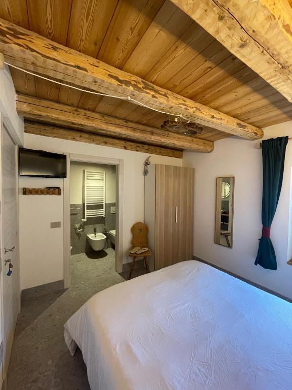 Postel nebo postele na pokoji v ubytování Locanda al Toal