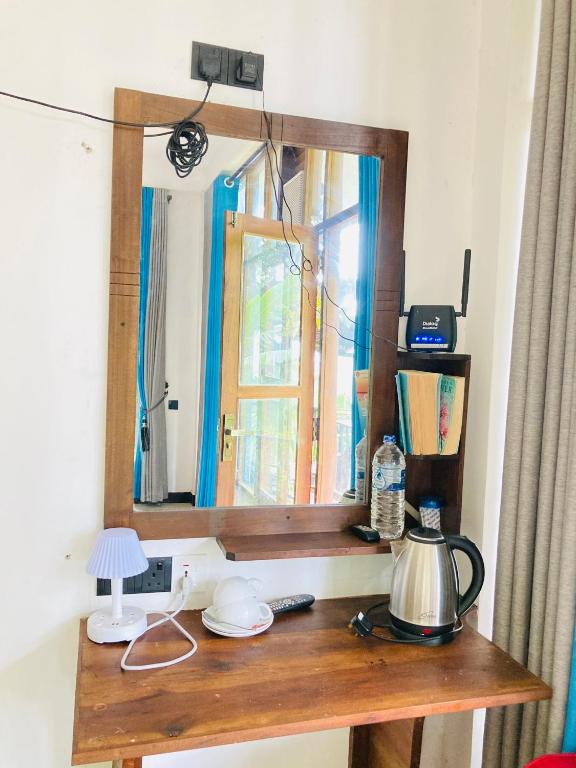 Příslušenství pro přípravu čaje a kávy v ubytování Pepper Garden Resort