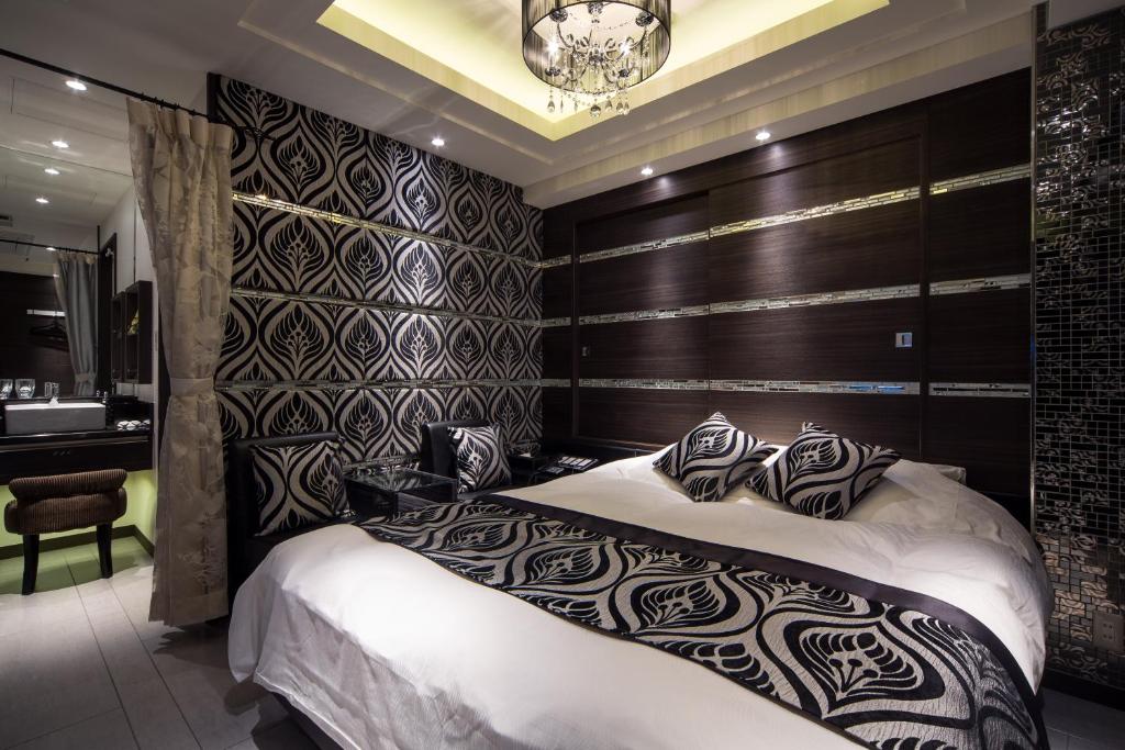 Postel nebo postele na pokoji v ubytování Hotel Lei