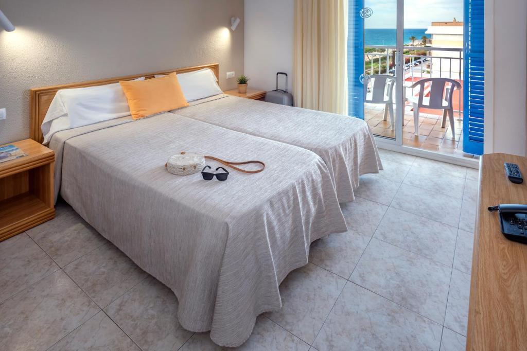 Postel nebo postele na pokoji v ubytování Hotel Sorrabona