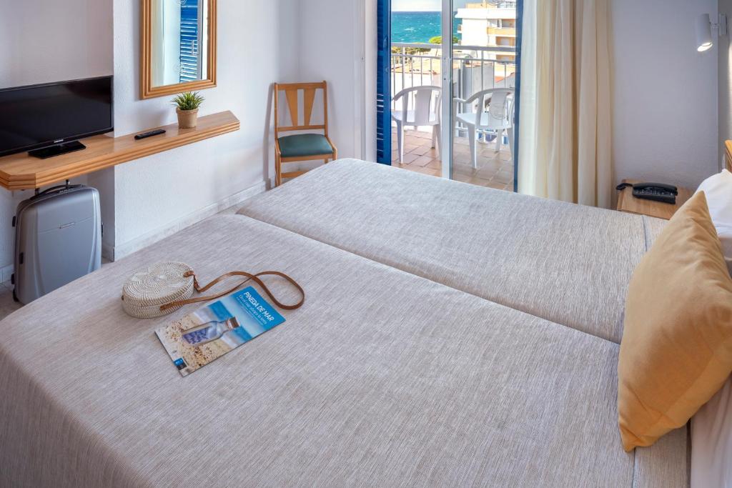 Postel nebo postele na pokoji v ubytování Hotel Sorrabona