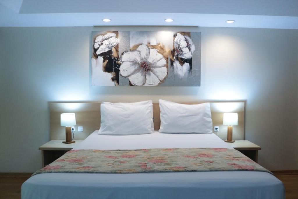 Ένα ή περισσότερα κρεβάτια σε δωμάτιο στο Hotel Golden Park Curitiba By Nacional Inn
