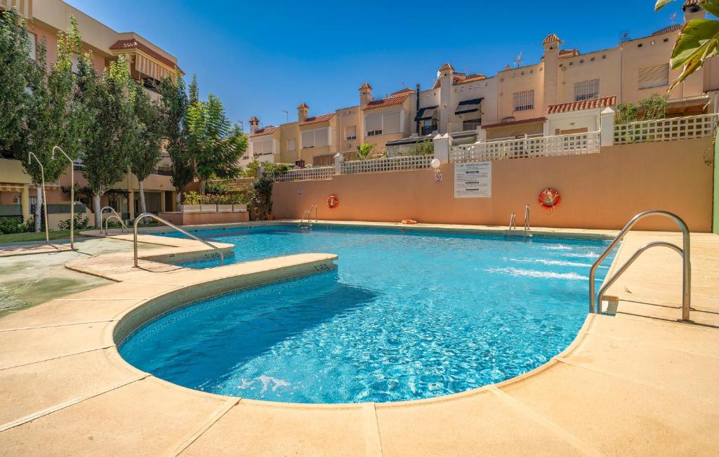 a swimming pool in the middle of a building at Nice Apartment In Aguadulce With Wifi in Aguadulce