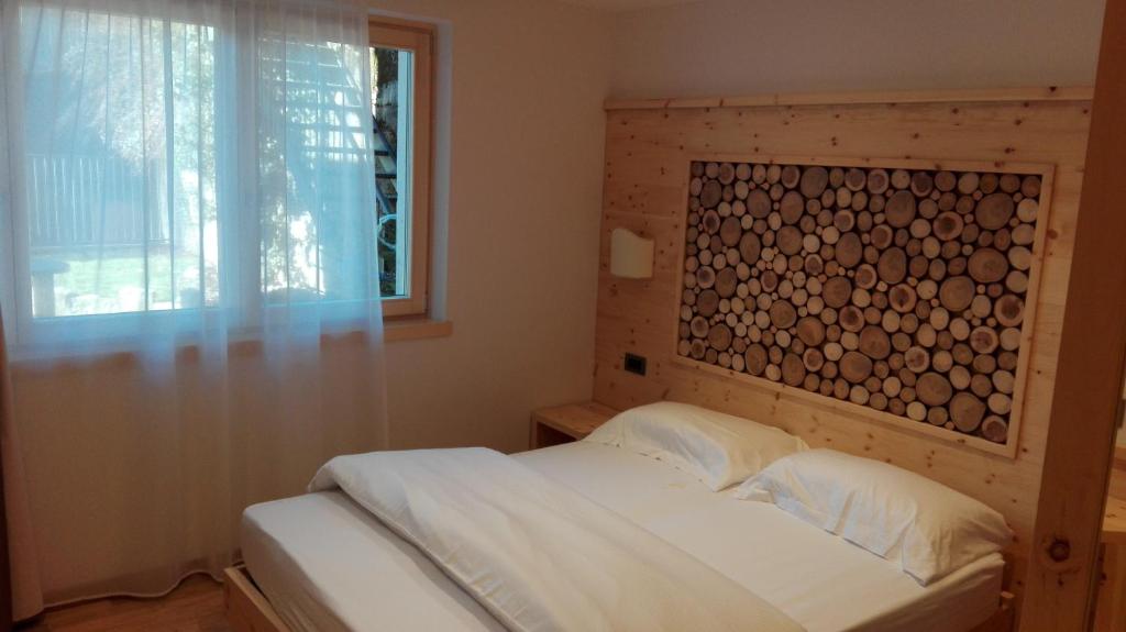 Postel nebo postele na pokoji v ubytování B&B Augusto