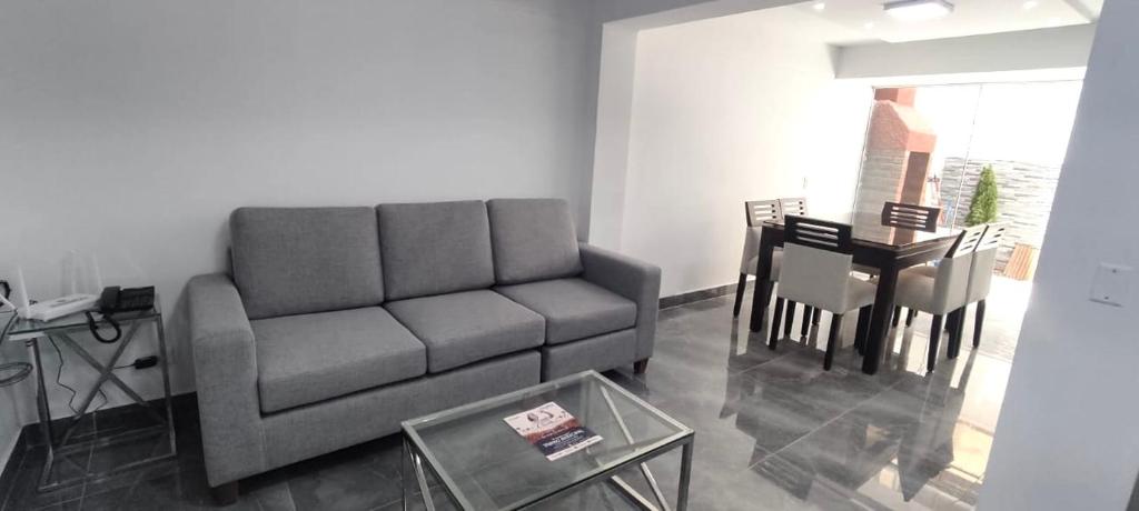 a living room with a couch and a table at El Polo Surco in Lima