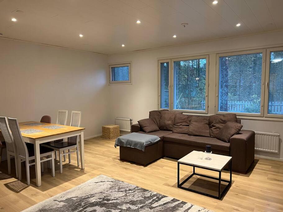 a living room with a couch and a table at Saukonkatu in Kokkola
