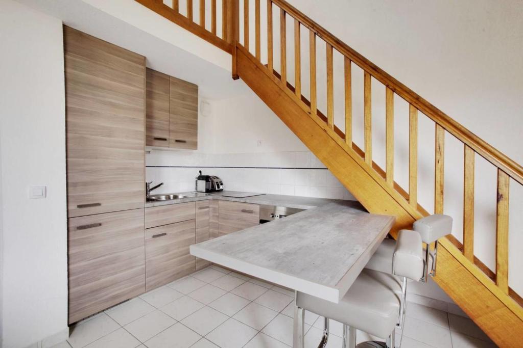Kuchyň nebo kuchyňský kout v ubytování Duplex Alberti - Welkeys