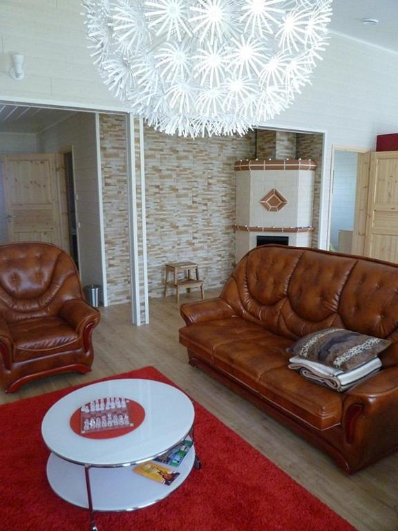 Posezení v ubytování Scandinavian Dream Cottages Vikajarvi- Rovaniemi