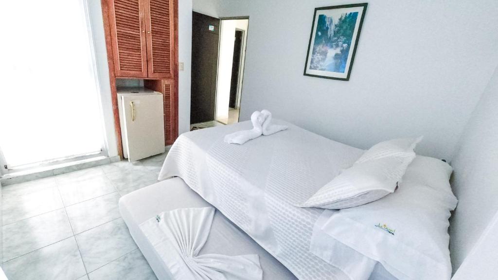 Postel nebo postele na pokoji v ubytování Miami Hotel