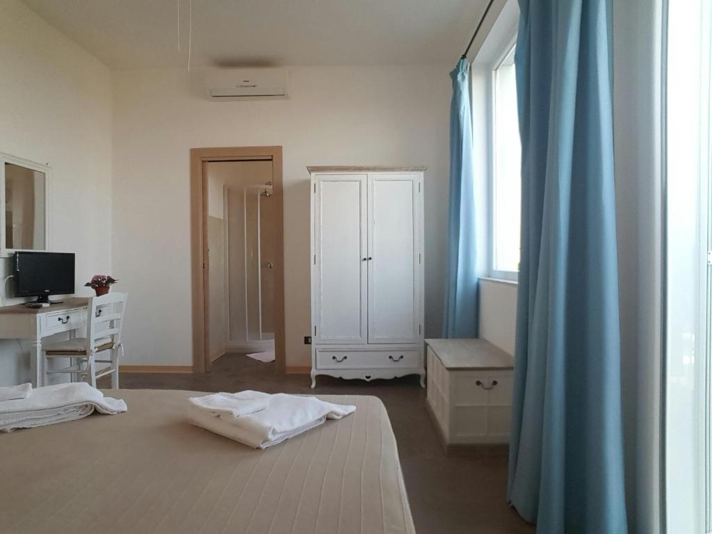 Postel nebo postele na pokoji v ubytování Hotel Borgo Cacciatori