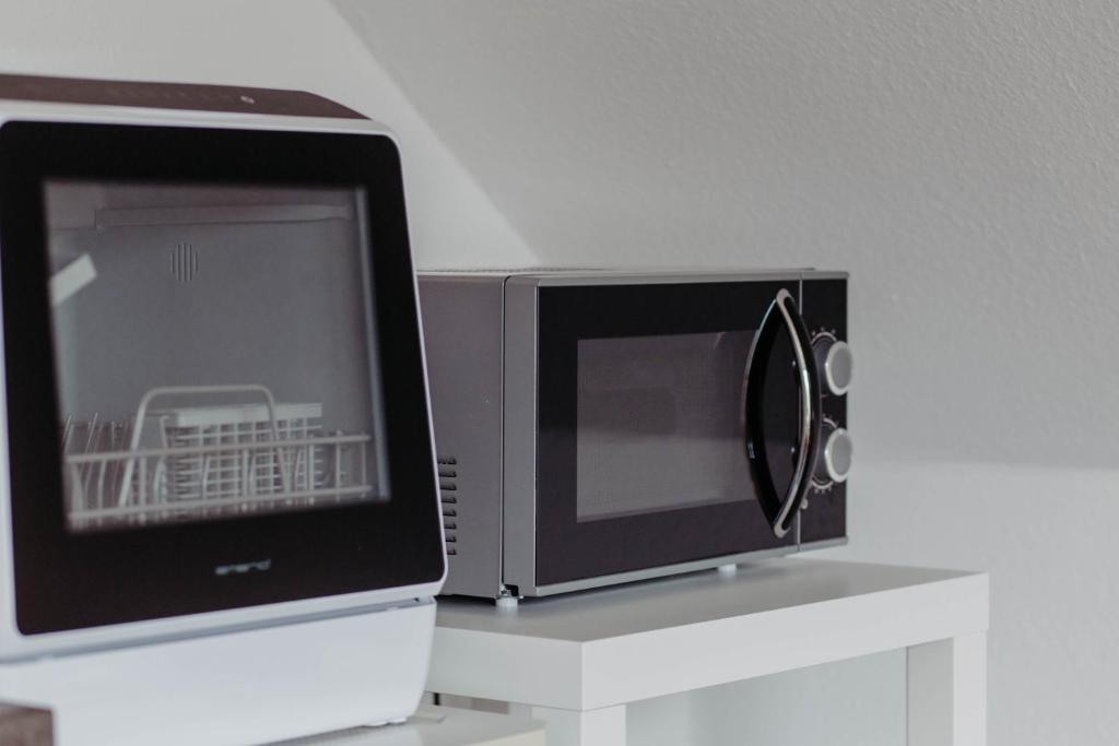TV a/nebo společenská místnost v ubytování Ferienwohnung Skandi