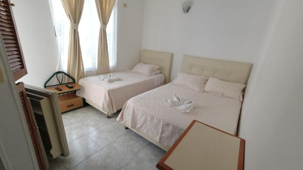 Postel nebo postele na pokoji v ubytování Miami Hotel