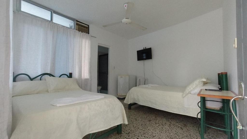 Postel nebo postele na pokoji v ubytování Miami Hotel