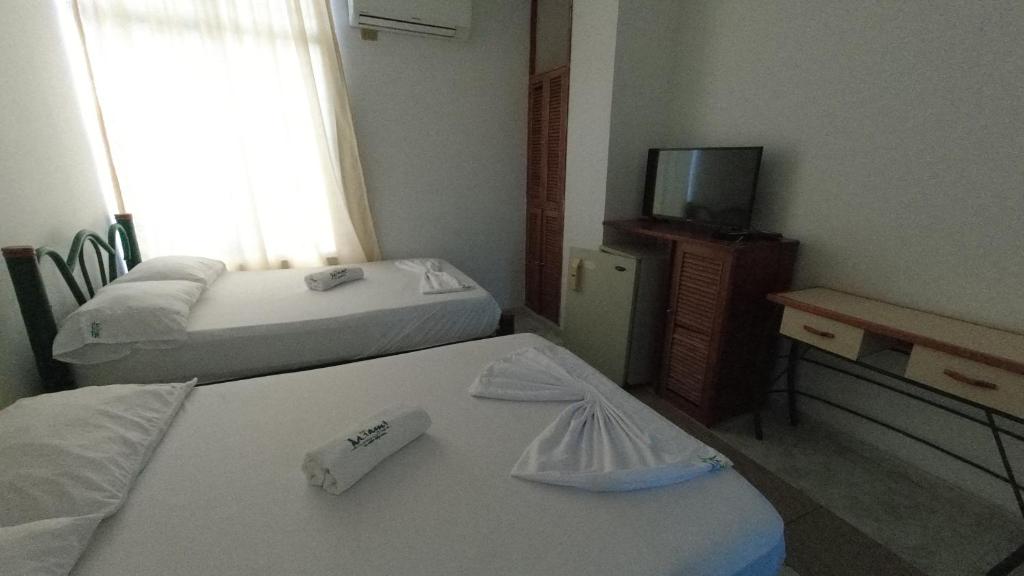 Postel nebo postele na pokoji v ubytování Miami Hotel