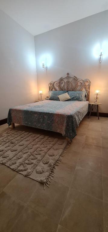 Postel nebo postele na pokoji v ubytování Beit El Ezz - Les Suites