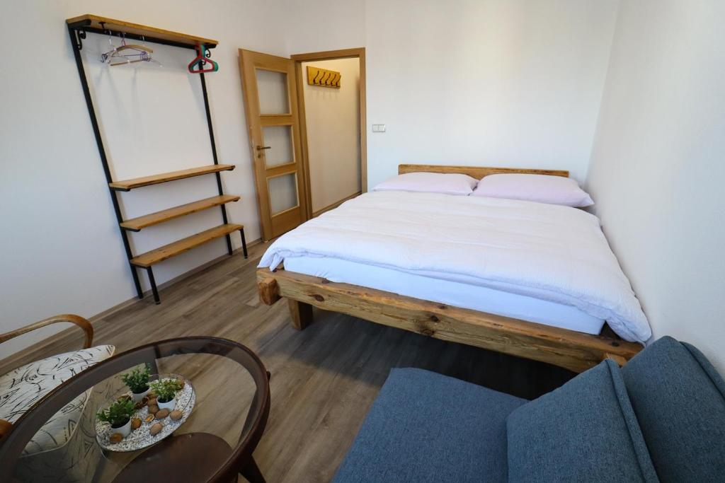 Postel nebo postele na pokoji v ubytování Penzion U HLAVÁČKŮ