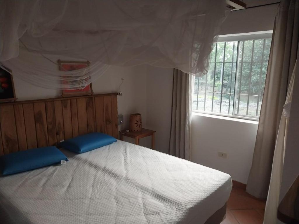 Postel nebo postele na pokoji v ubytování Casita de Piedra