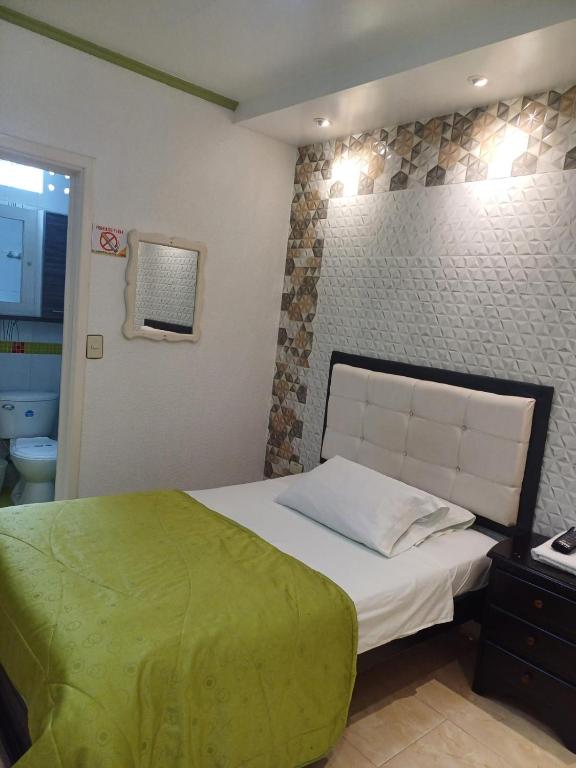 Voodi või voodid majutusasutuse Aparta-Hotel El Dorado toas
