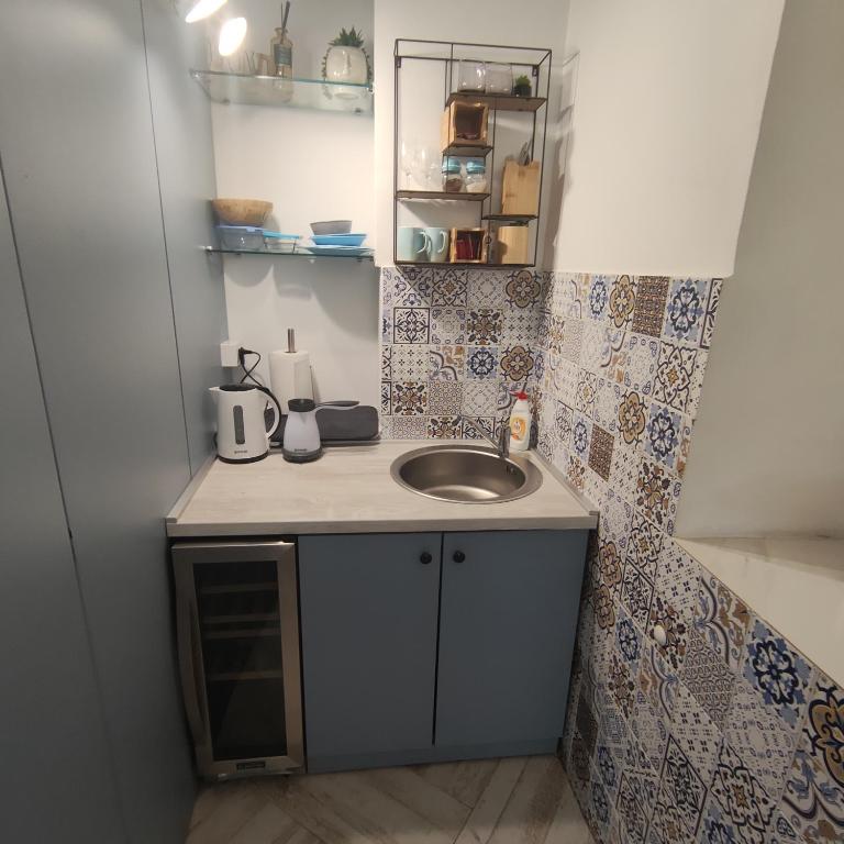 Kuchyň nebo kuchyňský kout v ubytování Room Angel