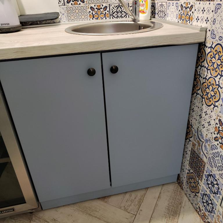 Kuchyň nebo kuchyňský kout v ubytování Room Angel
