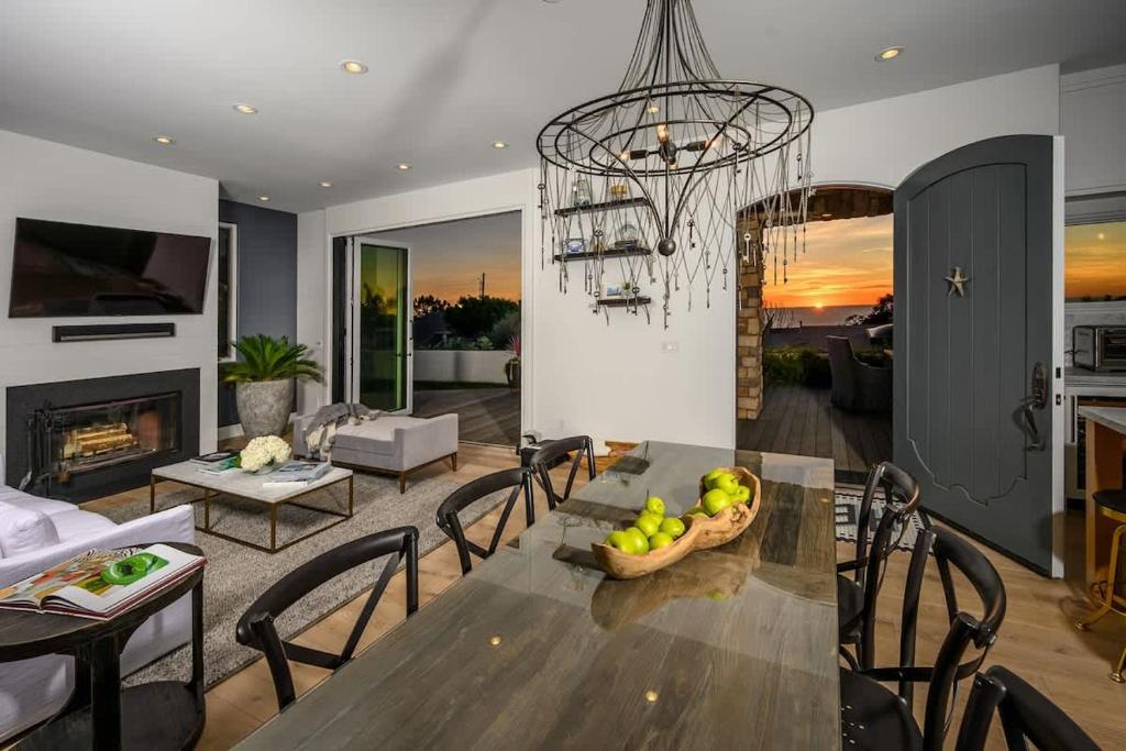 a dining room with a table with a bowl of fruit at 4BR Luxury Del Mar Beach House with Ocean Views in San Diego